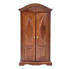 a wooden armoire with two doors and carvings