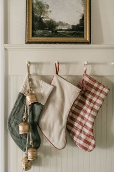 christmas stockings hung on the wall with bells