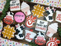 decorated cookies are displayed on a table