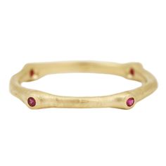 Four rich rubies emerge along a hand-hewn current of gold for a truly unique and naturalist band. This marine-inspired ring looks stunning solo or stacked up with other Johnny Ninos Barnacle rings. The stones are set organically throughout the band, placement may vary. Stones: Four Lab Grown RubiesMetal: 18k Yellow GoldMeasurements: Stone width: 1.5mm, Band width: 1.5-2.3mm Size 6 in stock Shipping and Delivery: IN STOCK items will ship within 2 business days Sizes not In Stock will be MADE TO O Hand Forged Ruby Ring In Red, Hand Forged Red Ruby Ring, Gold Stackable Rings With Ruby Bezel Setting, Hand Forged Ruby Ring Jewelry, Hand Forged Round Ruby Rings, Gold Stackable Ruby Ring, Stackable Gold Ruby Rings, Anniversary Ruby Rings Hand Forged, Anniversary Hand Forged Ruby Rings