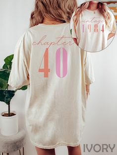 "Classic 1984 Shirts For Women, Vintage 40th Birthday Year Number Tshirt For Him, 40th Milestone Best Friend Bday Gift For Her, 40 Bday Shirt HOW TO ORDER ➀ Select color ➁ Select the size (Please check size chart) ✦ True to size. Size up 1-2 sizes for an oversized look. ➂ Add to cart ✦ (Optional) \"Add message to Seller\" on the checkout page. GARMENT FEATURES ✦ Crew neckline ✦ Direct to garment printing - no vinyl, decal, or iron-on technique ✦ Our designs are printed on the garment to last a long time and may not appear as 'glossy' or saturated as iron-on designs are. ✦ Please note that colors may appear different on different digital screens and may not be a true representation of the actual colors. ✦ Additional T-Shirt Colors and Sizes Available Upon Request ✧✧Brands: Bella Canvas Unis Vintage 40th Birthday, 1984 Shirt, Bday Shirt, Bday Gift, Garment Industry, Birthday Tshirts, 40th Birthday Gifts, Shirts For Women, T Shirts With Sayings