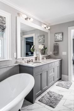 the bathroom is decorated in gray and white