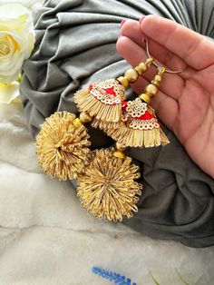 Beautiful handcrafted light weight  Gold Tassels / Latkanś. Made with golden base encrusted with  beads, diamanté and Cubic Zirconia crystals.  Perfect embellishments for accessorising bridal outfits, lehengas, Suits, Sarees, Blouse, Scarfs, party dresses dupattas, evening gowns and crafting upholstery, home décor and many more other versatile ideas to explore. Easy to sew on any type of material and anywhere on the edges and trimmings.  As these are all handmade, they may  have slight imperfections that are associated with these type of Handicraft.  Please note as these pieces are very delicate in nature, so  few beads or stones may come off during transit, so it's in nature not damaged. Also we will endeavour to ship this item in the best possible packaging.             Approximate Drop Bohemian Tikka With Latkans For Festivals, Multicolor Latkans Danglers For Diwali, Multicolor Danglers With Latkans For Diwali, Festive Multicolor Tikka With Latkans, Festive Multicolor Danglers With Latkans, Festive Bohemian Beaded Tassel Earrings, Bohemian Style Tikka For Navratri Festival, Red Tikka With Latkans For Festive Occasions, Red Latkans Tikka For Festive Occasions