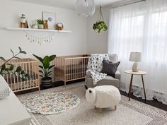 a baby's room with two cribs and a sheep rug on the floor