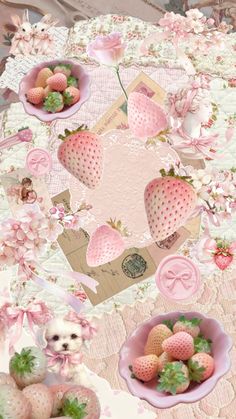 a table topped with plates and bowls filled with strawberries on top of a pink blanket