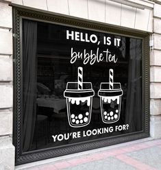 there is a window that has two drinks in it and the words hello, its bubble tea you're looking for?