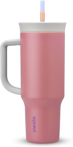 a pink coffee cup with a straw sticking out of it's top and lid