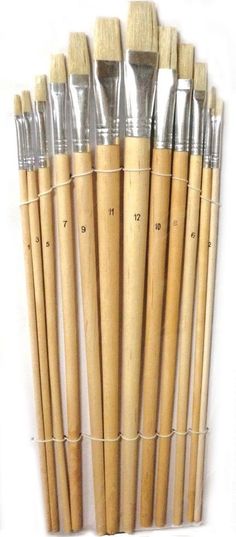 six wooden brushes are lined up in a row