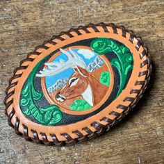 "Vintage Painted Deer in Wilderness Scene Leather with woven edge band western themed design belt buckle.   Small markings on buckle, as pictured.  Buckle measures approximately 4 1/4\" across x 3\" tall.  Buckle sold as is, as described.  All sales final." Painted Deer, Western Buckles, Suspender Belt, Vintage Painting, Belt Buckle, Belt Buckles, Deer, Buckle, Band