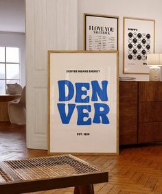 there is a poster on the wall in the living room that says den ver