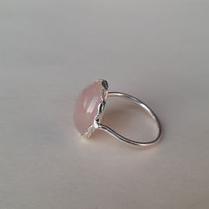 Handmade Rose quartz bohemian ring , you can wear this ring as a party wear ring .. Title - Rose Quartz stone ring Stone color - Pink Stone shape - oval Material - Sterling silver 925 Note - We use natural gemstones, so color shade may be little bit different .. we are giving you best quality rings on best price .. contact us for more quantity Elegant Handmade Rose Quartz Rings, Pink Sterling Silver Crystal Ring, Handmade Adjustable Rose Quartz Rings, Silver Rose Quartz Crystal Ring, Pink Sterling Silver Crystal Ring With Gem, Pink Stone Ring, Quality Rings, Pink Stone Rings, Green Stone Rings