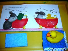 two rabbits in bath tubs with rubber ducks