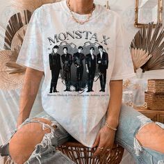 "Monsta x Y2K Tee - Monsta x Shirt - Kpop Shirt - Kpop Gift for her or him - Kpop Y2K T-shirt This is our unisex shirt, and it's true to size. To get the oversized look, you have to choose +1 or +2 of your original size number. If you're not sure about your size, you can refer to our size chart. Reach out if you have any issues with your order! The unisex heavy cotton tee is the basic staple of any wardrobe. It is the foundation upon which casual fashion grows. The specially spun fibers provide a smooth surface for premium printing vividity and sharpness. No side seams mean there are no itchy interruptions under the arms. The shoulders have tape for improved durability. .: 100% cotton (fiber content may vary for different colors) .: Medium fabric (5.3 oz/yd² (180 g/m .: Classic fit .: Tear Kpop Shirts, Workout Tee, Casual Wardrobe, Favorite Shirts, Monsta X, Unisex Shirt, Wardrobe Essentials, Unisex Sweatshirt, Heavy Cotton