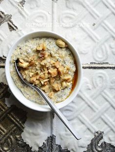 a bowl filled with oatmeal sitting on top of a table