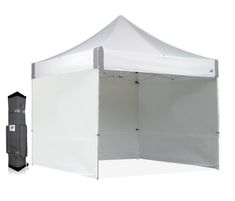 a white tent with the door open next to it