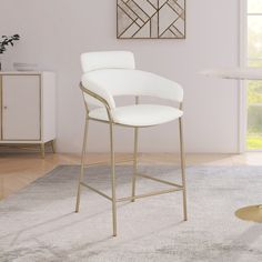 a white counter top sitting on top of a rug in a living room next to a table