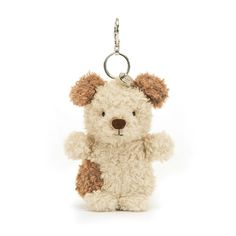 a teddy bear keychain is shown on a white background