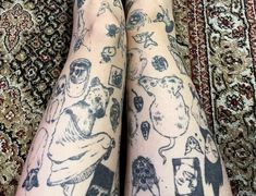 the legs are covered with tattoos on them