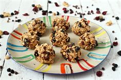 a plate full of granola and raisins on a table