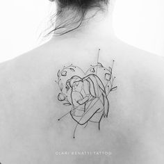 the back of a woman's shoulder with a tattoo design on her left side