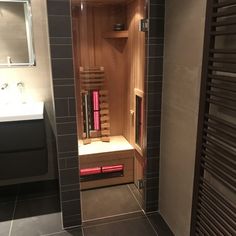 a walk in sauna with the door open to show it's interior space