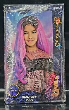 the doll has pink hair and is in plastic packaging