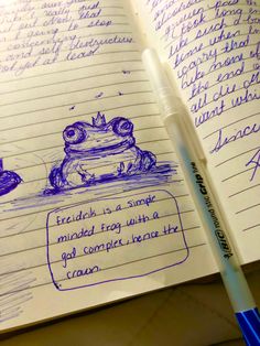 a drawing of a frog sitting on top of a table next to a pen and paper