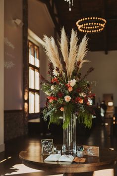 a table with flowers and cards on it