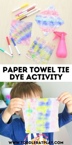 a boy holding up a piece of paper with the words paper towel tie dye activity on it