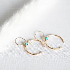 These gorgeous open circle hoops feature hand formed and hammered upside-down crescent moons with gorgeous genuine Turquoise stones secured at the top in my original bezel wrapped style.  These adorned crescents dangle beautifully from hand formed French style ear wires.  A perfect blend of modern and boho with a little Southwestern flare, these make a great addition to any collection.  Available in 14k Gold Filled , 14k Rose Gold FIlled or Sterling Silver metals  Earrings - Approx 1 1/2 inches Minimalist Hammered Crescent Jewelry, Minimalist Crescent Hammered Jewelry, Elegant Hammered Crescent Jewelry, Elegant Crescent Hammered Jewelry, Elegant Crescent Shaped Hammered Jewelry, Elegant Crescent Hoop Earrings With Moon Charm, Hammered Crescent Jewelry, Minimalist Semi-circle Jewelry As Gift, Adjustable Hoop Moon Charm Jewelry