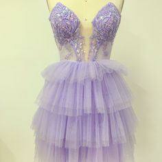 This Dreamy Lavender Mini Dress Combines Elegance And Romance With Its Tiered Tulle Skirt And Intricate Floral Embroidery. The Sheer Bodice Adds A Touch Of Femininity And Allure, Making It The Perfect Choice For Homecoming Dances, Wedding Guests, Or Special Parties. This Dress Will Not Only Make You Stand Out But Also Provide A Comfortable And Confident Wearing Experience. Lavender Mini Dress, Tiered Tulle Skirt, Tulle Mini Dress, Homecoming Dance, Wedding Guests, Floral Embroidery, Tulle Skirt, Homecoming, Bodice