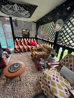 a living room filled with lots of colorful furniture