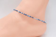 .  Beach Anklet, Beaded Anklet, Anklet Jewelry, Ankle Bracelet, Boho Anklet, Hippie Anklet, Gift For Her, Women's, Blue Anklet, Hippie Anklet Dainty anklet is made with 11/0 Czech seed beads in different shades of blue and clear, with 2mm silver filled beads with a lobster clasp.  All items in my store are made buy me. Please send me a message if you want a custom order or need a size that is not listed in the drop down menu.  Size: Measure your anklet above the anklet bone with measuring tape. Blue Anklet, Women Anklets, Anklets Boho, Beach Anklets, Beaded Anklets, Stackable Bracelets, Anklet Jewelry, Matching Bracelets, Body Jewellery