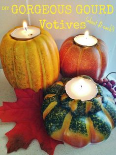 three pumpkins and two candles sitting on top of each other with the words, gorgeous gourd votives