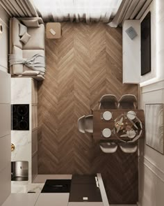 an overhead view of a small kitchen and dining area