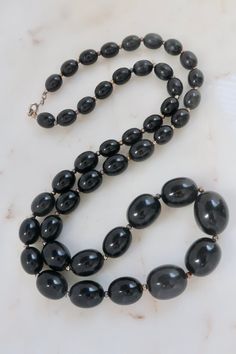 "Vintage Black Beaded Necklace. Length: 30\" Vintage condition! please zoom in. Back to the shop: https://www.etsy.com/shop/SusVintage?ref=hdr_shop_menu Don't hesitate to contact me if you have any further questions. Thank you!" Black Oval Beaded Necklaces, Vintage Black Beaded Necklace With Large Beads, Vintage Black Beads For Gifts, Vintage Black Necklace With Oval Beads, Vintage Black Beads For Gift, Vintage Black Large Beads, Black Vintage Large Beads, Vintage Large Black Beads, Vintage Black Beaded Jewelry