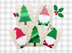 paper christmas tree cut outs with scissors and holly on the top one has santa's helper