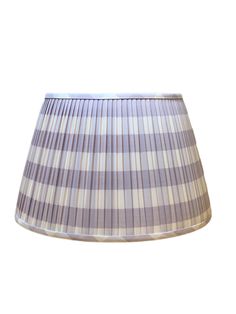 a purple and white plaid lamp shade on a white background with room for text or image