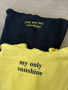 ✰COMES WITH TWO! ITEM 1: refers to "you are my sunshine" ITEM 2: refers to "my only sunshine" Photo features: Black Hoodie X Yellow Thread // Yellow Hoodie X Black Thread Navy Blue Sweatshirt x White Thread // White Sweatshirt x Dark Blue Thread ✰Embroidered Matching Sweatshirts✰UNISEX✰Hand drawn and designed✰Super soft and comfy! *Sizes 2XL-3XL may be subject to longer processing times since we don't carry a large amount of inventory in those sizes, so we would have to put in a special order fr You Are My Sunshine Sweatshirt, Birthday Hoodie Ideas, Matching Sweatshirts For Friends, You Are My Sunshine Gifts, Couple Sweatshirts Diy, You Are Sunshine, Making Matching Hoodies, Couple Hoodies Relationships, Embroidered Hoodie For Boyfriend