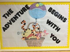 a bulletin board with winnie the pooh, tigger, and tigger in a basket