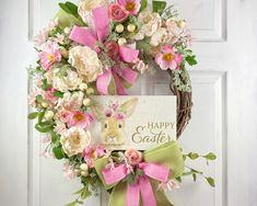 a happy easter wreath with pink and white flowers