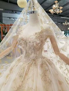 a wedding dress on display in a store