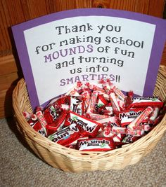 a basket full of candy with a sign in the middle that says thank you for making school mounds of fun and turning nuts into smarties