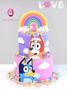 a colorful cake with cartoon characters on it