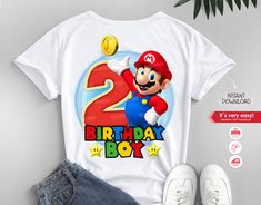 an image of a mario birthday shirt with the number two on it and a pair of jeans