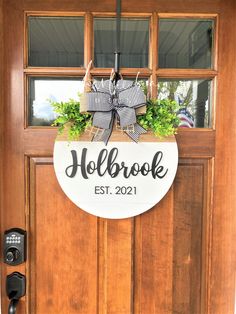 a wooden door with a sign that says holb brook