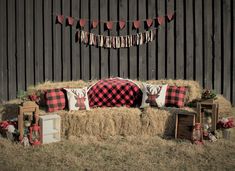 a hay bale filled with pillows and blankets