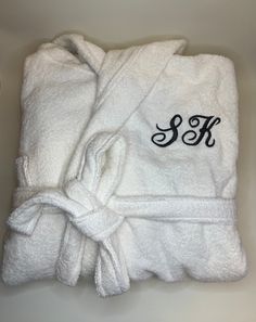 These personalised luxurious bathrobes make the ideal Christmas/Fathers Day/Mothers Day/Birthday/Engagement/wedding/Valentines/Anniversary gift. The robes are 100% Egyptian Cotton 550 GSM and are extremely soft to the touch with a thick pile.  These are proper towelling robes not the cheaper fleece variety. They come in eight colours - black, white, navy, grey, cream, hot pink/fuschia, aqua and purple/wine and can be embroidered with the name of that special someone in your life.  The price includes the embroidery. The robes come in one large size with the following approximate measurements :- Chest size - 138 cm (this is the measurement completely around the chest) Height from shoulder to hem - 125 cm. The embroidery is done on the left hand chest. All robes come beautifully gift wrapped Personalized Robe, Unique Gift Items, Valentine Anniversary, Purple Wine, Embroidered Name, Early Christmas Shopping, Get Well Gifts, Embroidered Towels, Navy Grey