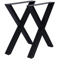 a black metal table with two legs on the top and one leg raised up in the air