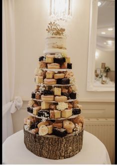 a wedding cake made out of doughnuts on top of a table